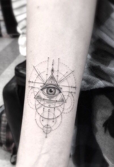 an all seeing eye tattoo on the arm