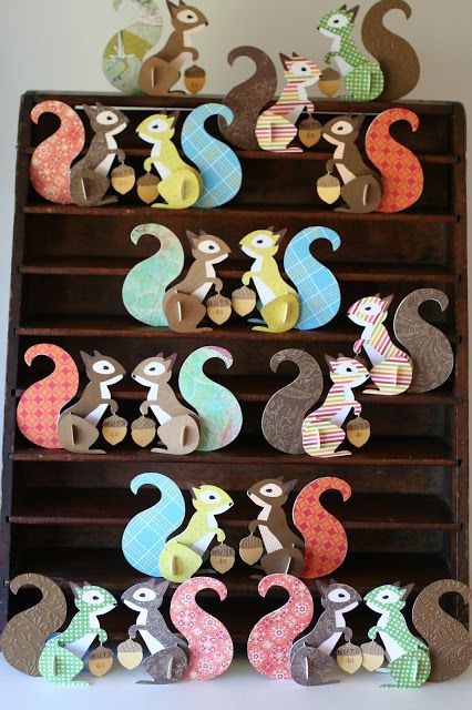 a wooden shelf filled with lots of different colored seahorses on top of it