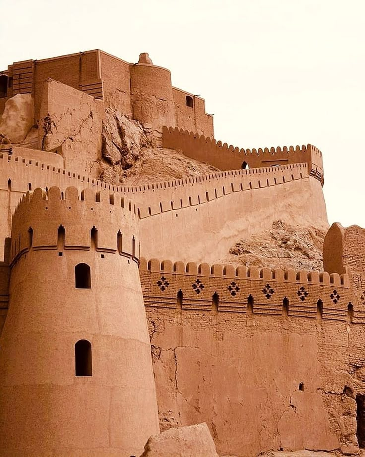 an old castle built into the side of a mountain