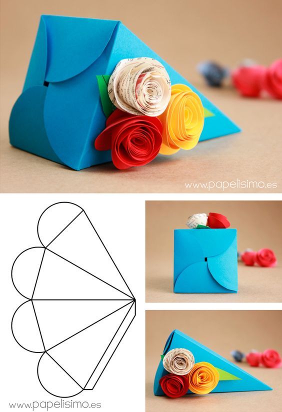 an origami flower bouquet made out of paper and rolled up in the shape of a envelope