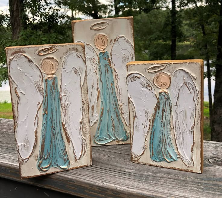 Beautiful handmade, hand painted, textured angels come in a set of three varying sizes: 6x8, 6x10, and 6x12. Background is ivory, and angels are in blue gowns. Makes a striking display for mantle, table, or entry. Sold individually. Artist signature and company name are included on the back. Because each design is individually drawn, painted, and textured, each piece is unique and will vary slightly. Blue Gowns, Artist Signature, Blue Gown, Artist Signatures, Congo Kinshasa, Pitcairn Islands, Equatorial Guinea, Guinea Bissau, Wood Blocks