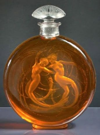 a glass bottle with an image of a naked woman in the top and bottom half