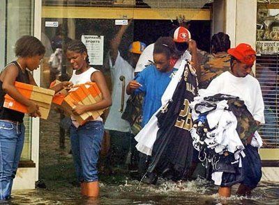 some people are standing in the water with boxes