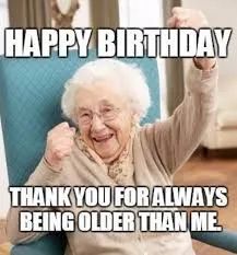 an old woman sitting in a chair with her fist up and the words happy birthday thank you for always being older than me