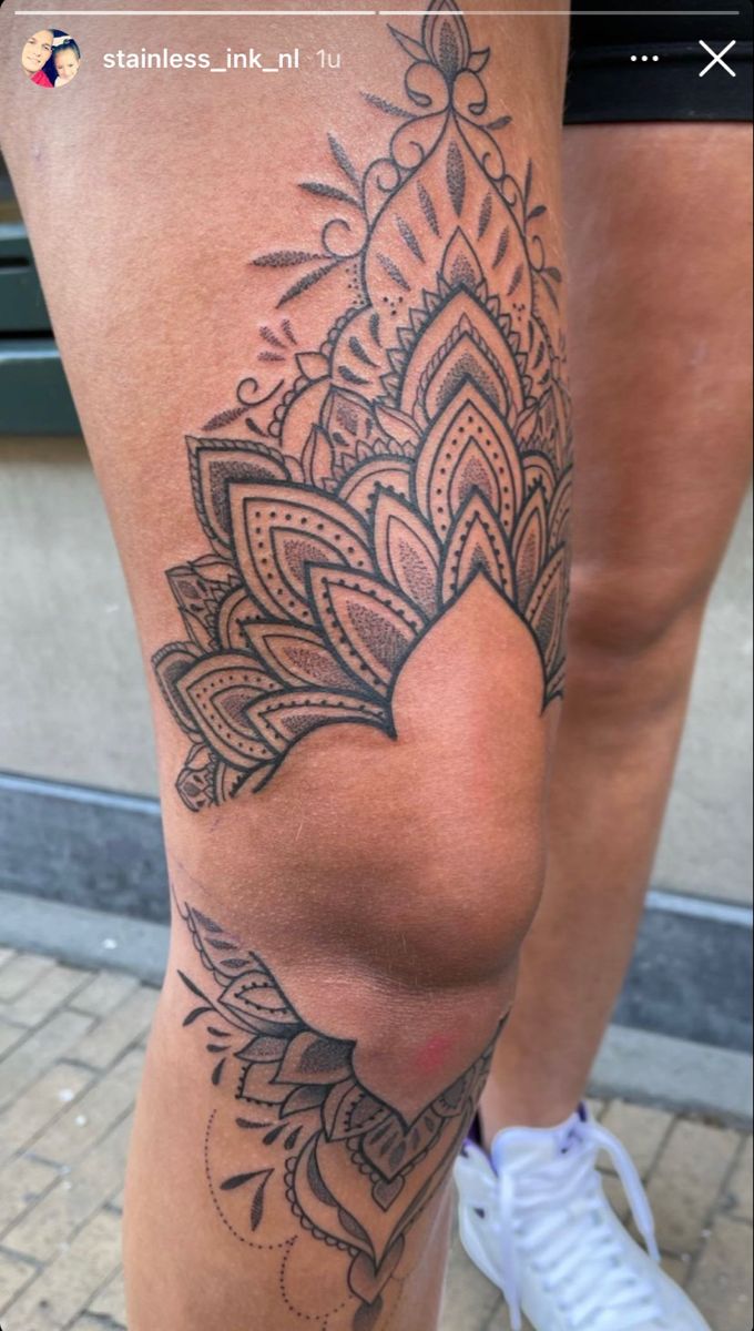 a woman's leg with a tattoo on it that has a heart in the middle