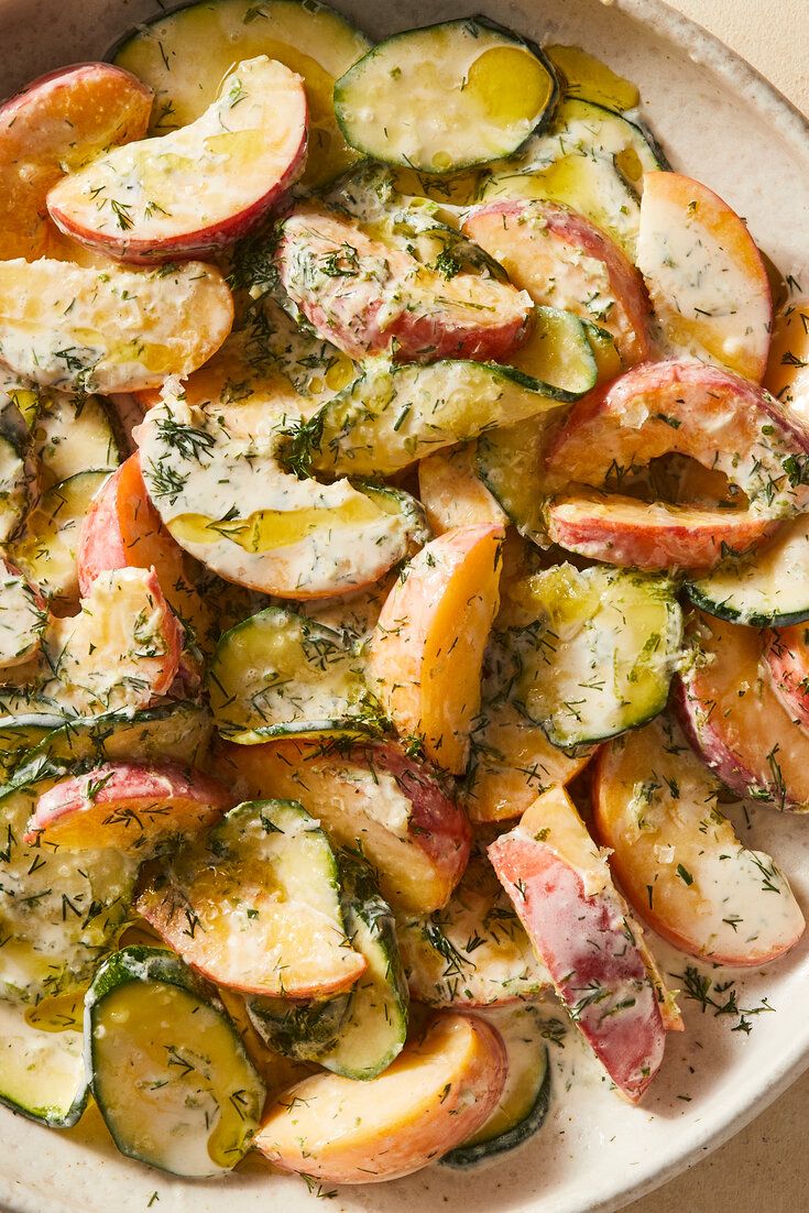 a white bowl filled with sliced up vegetables