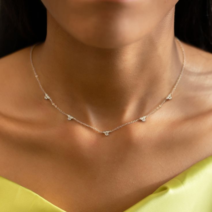 This necklace features five intricate crystals evenly spaced apart on a delicate, diamond-cut cable chain from our signature O Collection. Pair it with other necklaces from this collection. Our patented connectors let you easily link and layer necklaces in any order you desire. Cubic Zirconia with Bezel setting, 4mm Adjustable chain: 15-18in (38-46cm) When layered, chain length is: 15-21in (38-53cm) Learn more .925 Sterling Silver Spring clasp closure Hypoallergenic, lead and nickel free #186S Dainty Station Necklace With Single Cut Diamonds, Layered Gold Jewelry, Simple Crystal Necklace, Layer Necklaces, Necklaces Unique, Dainty Choker Necklace, Layered Choker Necklace, Silver Necklace Set, Dainty Choker