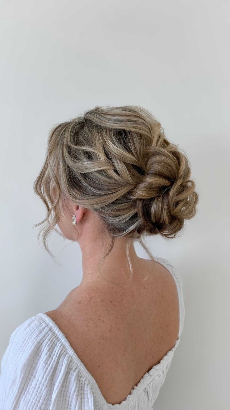 Wedding Updos For Medium Hair Front View, Bun Hairstyles Wedding, Prom Updos Bun, Bride Messy Bun, Up Do Bridesmaid, Curled Low Bun, Deb Hairstyles Bun, Messy Prom Hair, Low Messy Wedding Bun