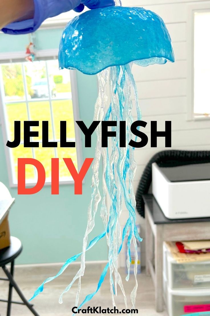 holding a blue and white jellyfish made out of resin Resin Jellyfish Diy, Plastic Bottle Jellyfish Diy, Hanging Jellyfish Diy, Jellyfish Arts And Crafts, Kids Lamp Diy, Diy Jellyfish Decoration, Jellyfish Crafts, Jelly Art Style, Hanging Jellyfish