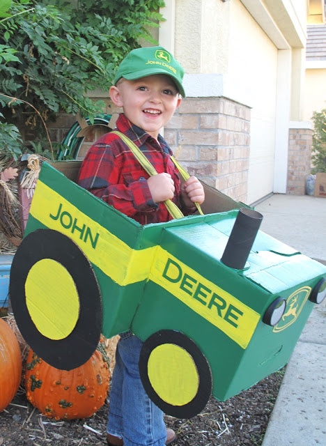 a young boy dressed up as john deere