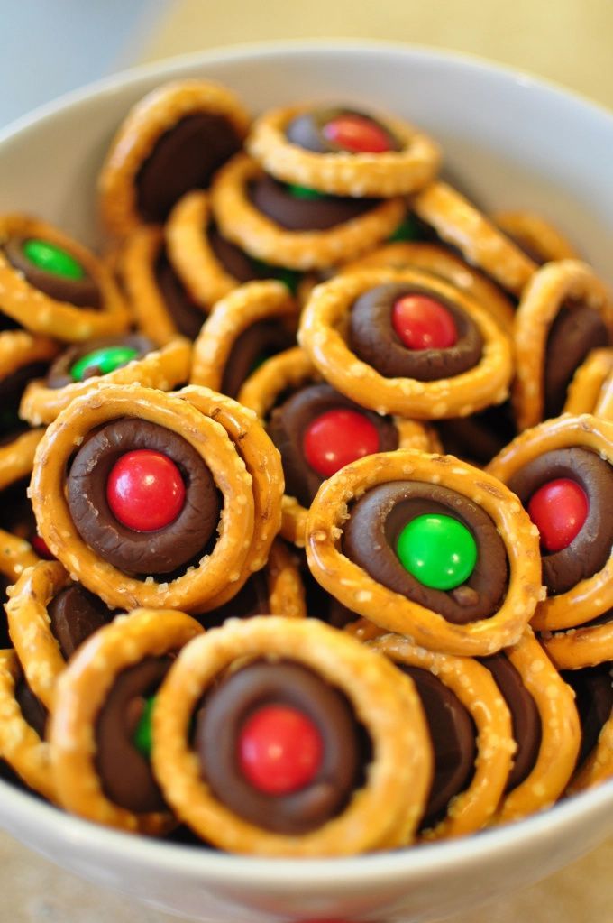 a bowl filled with pretzels and candy