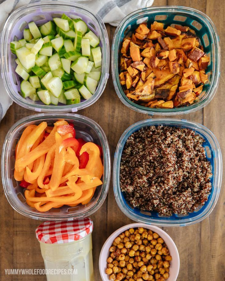 four containers filled with different types of food