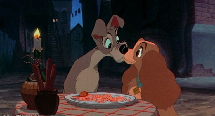 lady and the tramp looking at each other in front of a plate of food