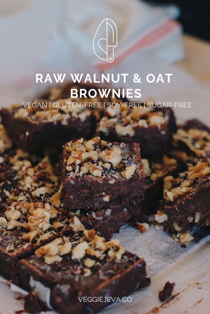 raw walnut and oat brownies on a wooden cutting board with text overlay