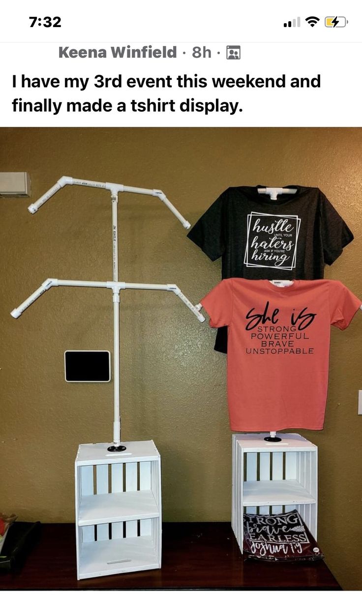 two t - shirts are on display in front of a wall with the words i have my 3rd event this weekend and finally made a shirt display