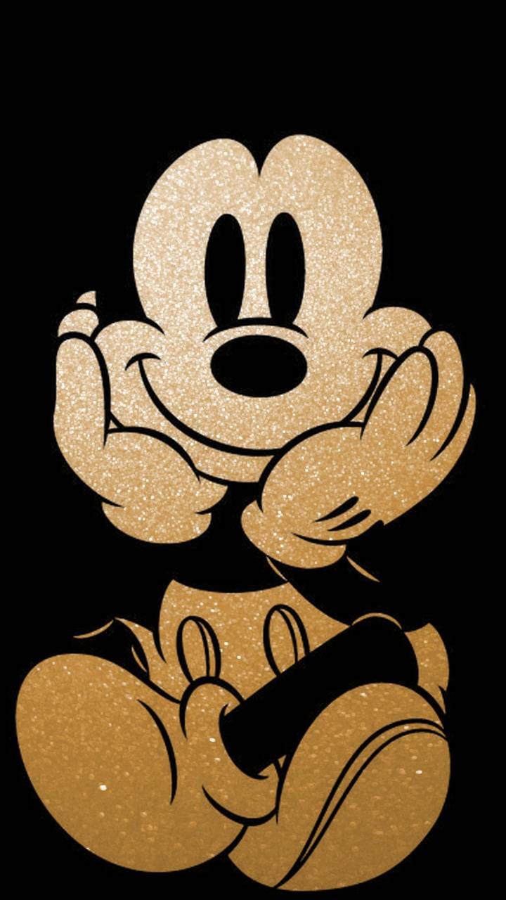 a mickey mouse with his arms crossed in front of him and the words disney written on it