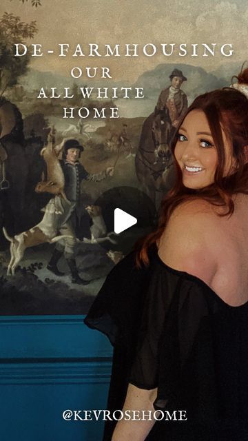 a woman standing in front of a painting with the caption de - farmhouseing our all white home