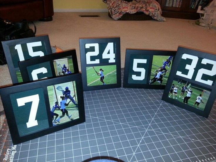 four frames with numbers on them sitting on a table