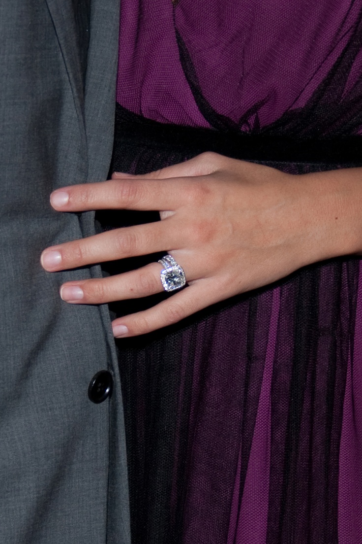 a close up of a person wearing a ring