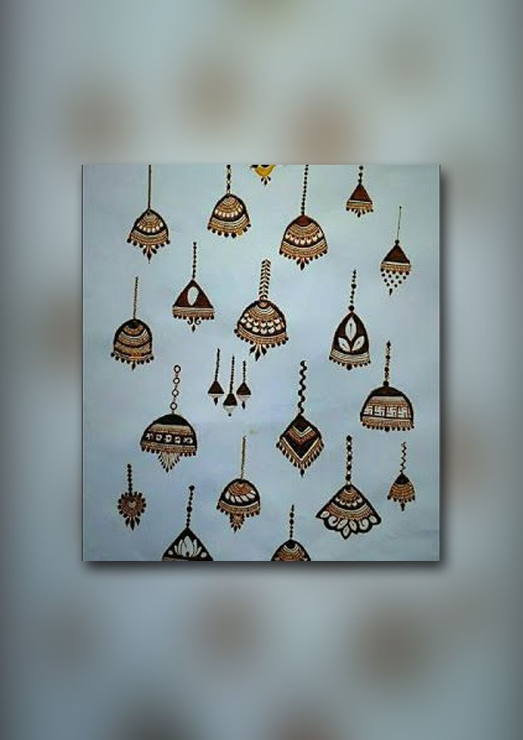 an artistic painting with hanging ornaments on the wall