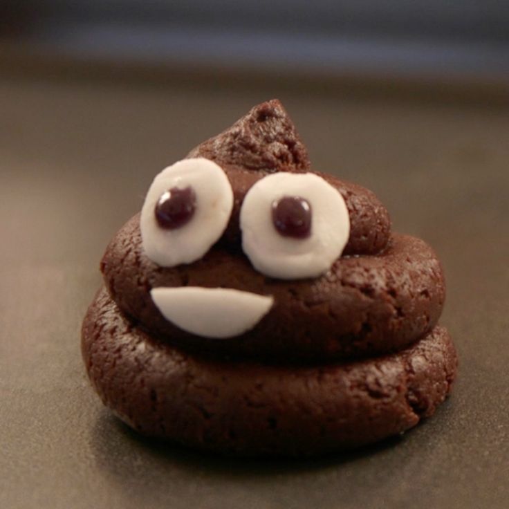 a chocolate cookie with googly eyes on it