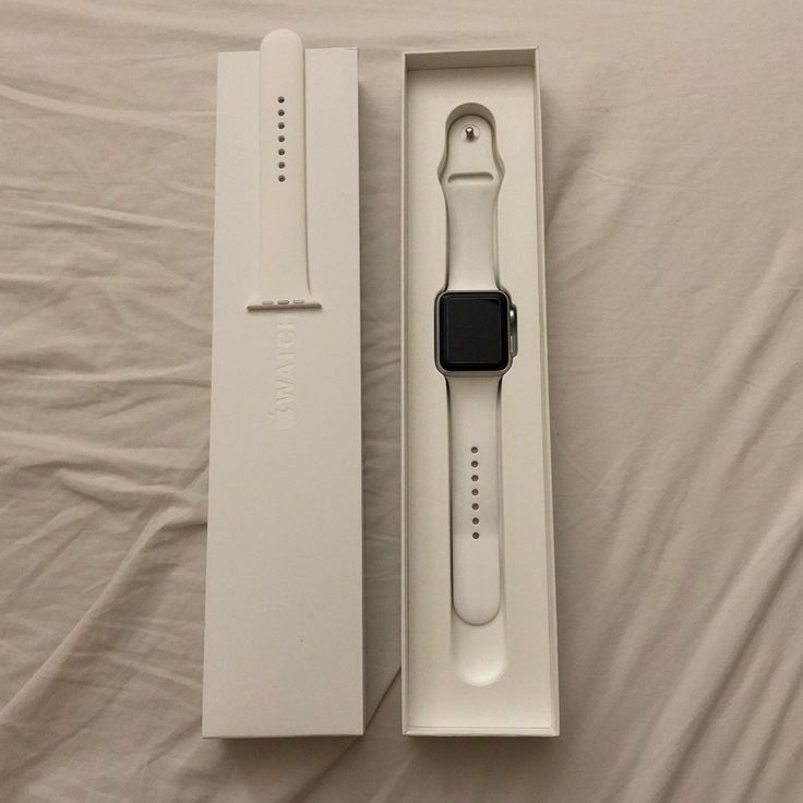 an apple watch in its box on a bed