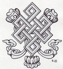 a drawing of an ornamental design with two snakes and flowers in the center, on white paper