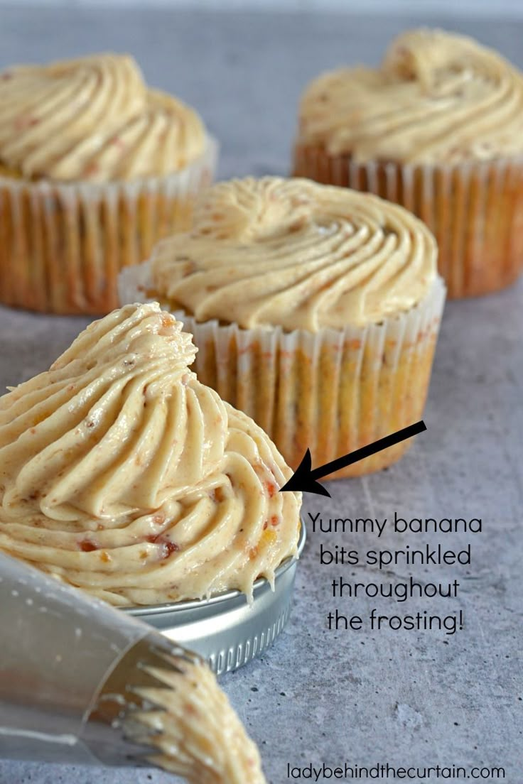 cupcakes with peanut butter frosting in a tin