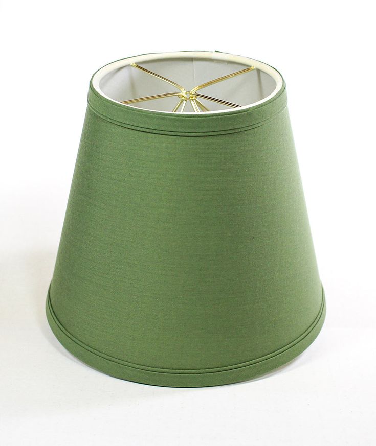 a green lamp shade on a white background