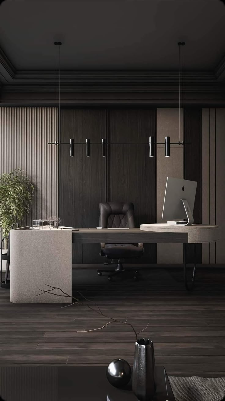 an office with a desk, chair and laptop on the table in front of it