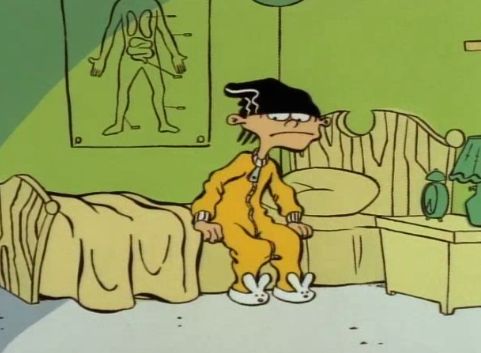 a cartoon character is standing in front of a bed