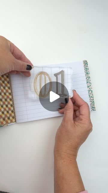 someone is making a diy card with the letter d in gold and silver on it