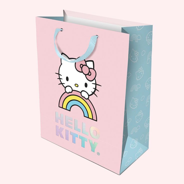 A light pink and blue hello kitty bag with holographic lettering that reads Hello Kitty Gift Bags, Hello Kitty Rainbow, Birthday Gift Bags, Rainbow Sky, Birthday Wrapping Paper, Hello Kitty Birthday, Something Big, Bag Set, Medium Bags