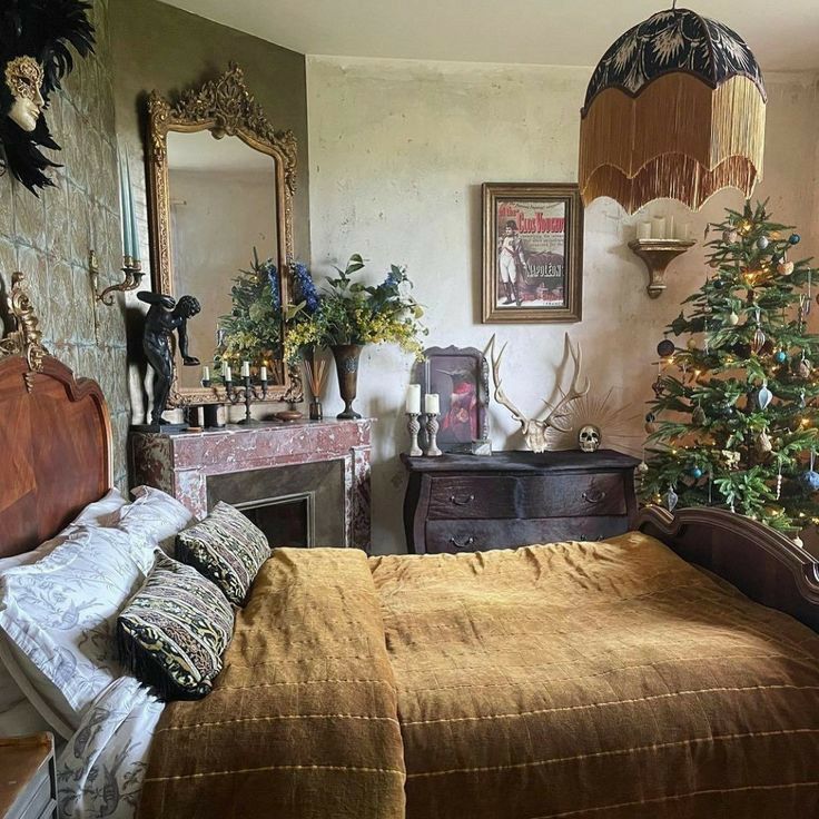 a bedroom with a bed, mirror and christmas tree