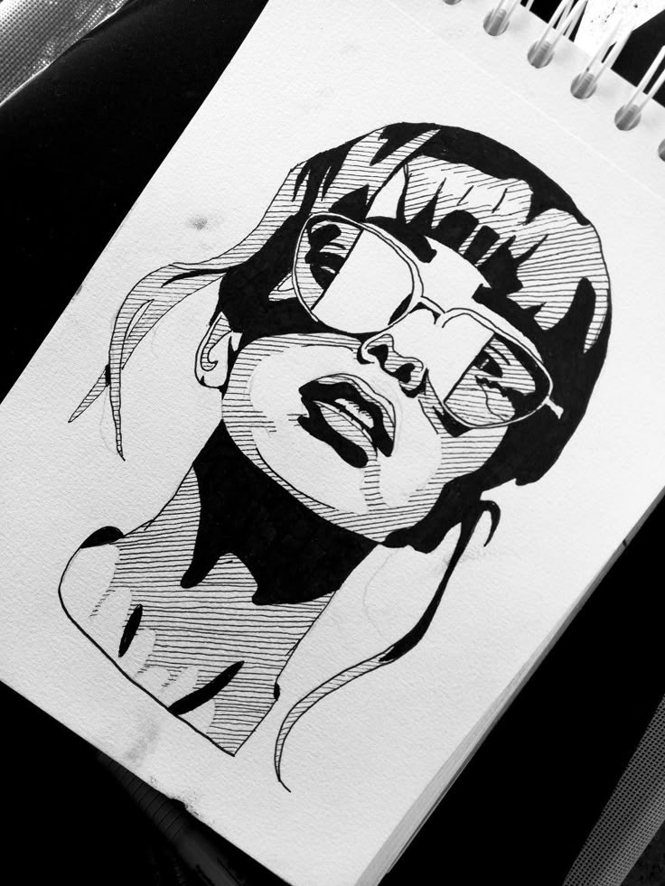 a black and white drawing of a woman's face with glasses on top of it