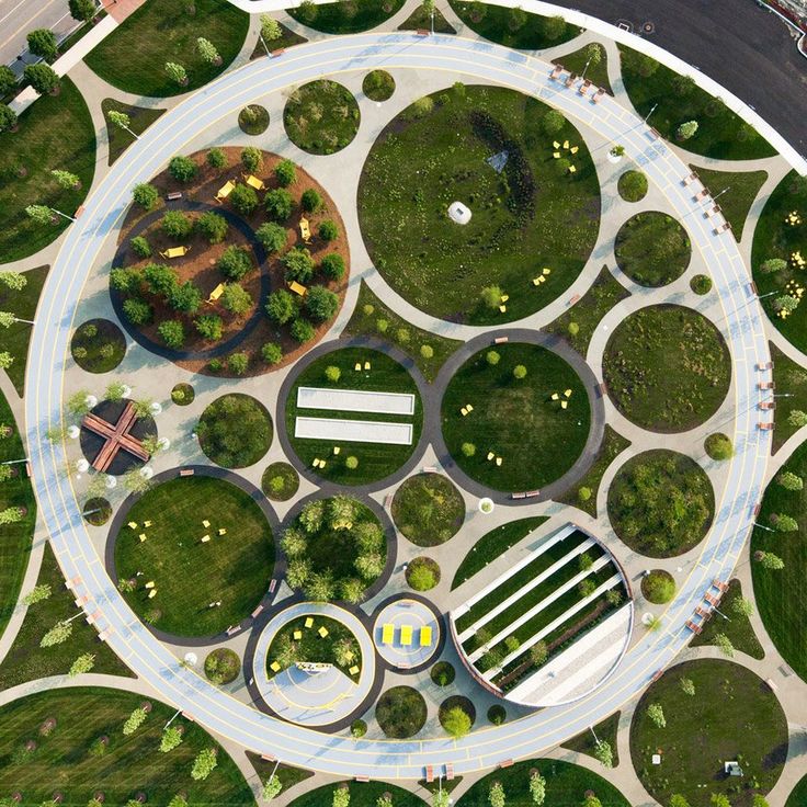 an aerial view of a circular garden in the middle of a city