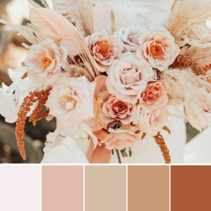 a wedding bouquet with flowers and feathers in shades of brown, pink, beige and white