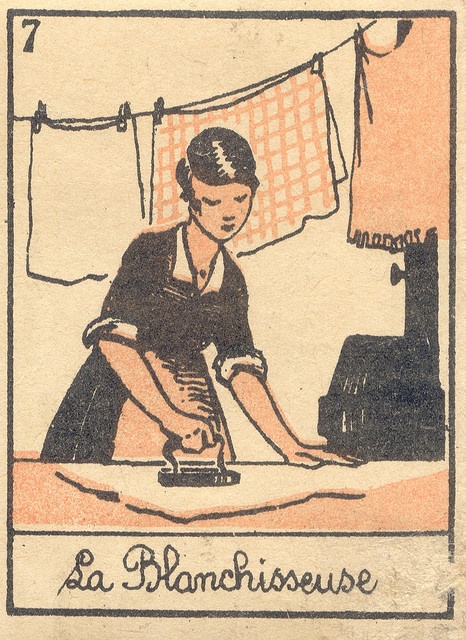 an image of a woman ironing clothes