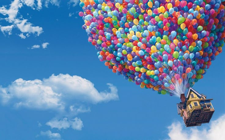 a house is floating in the air with balloons