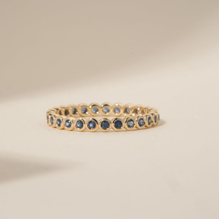 Timeless, elegant & dainty, this rich shade of blue will make you feel like royalty each time you gaze at your hand! This can be your vibrant and unique wedding band, yet also the perfect dainty ring to add a pop of color to your solid gold ring stack. This is a full eternity band surrounding the entire finger. Choose your metal and size, and we will make it custom for you. September's birthstone is a stunning ring to stack with your wedding ring! - Handmade - Solid Gold - Natural Blue Sapphire - Total Sapphire Carat Weight: 1 ctw for size 6.5 - Width of the Band: 2.5 mm - Height of the Band: 1.7 mm 🛠 Your Sarah Elise piece is handcrafted with care! Ready-to-ship items go out within 3 business days. Made-to-order pieces typically take 7-10 business days to create. If you need something so Bezel Eternity Band, Birthstone Wedding Ring, Sapphire Eternity Band, Sapphire Eternity Ring, Zierlicher Ring, Unique Wedding Bands, Wedding Ring Set, Jewelry Lookbook, Initial Jewelry