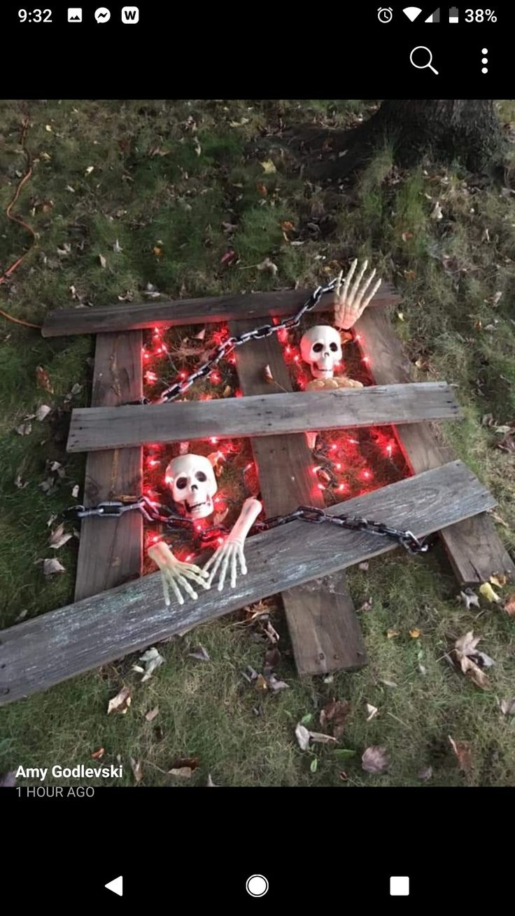 an image of a skeleton laying on the ground with red lights in its eyes and hands