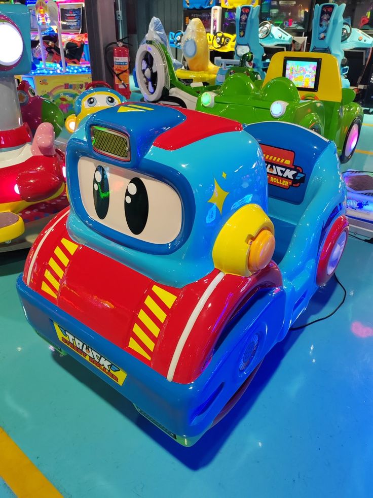 children's toy cars are on display in a store or playroom with other toys