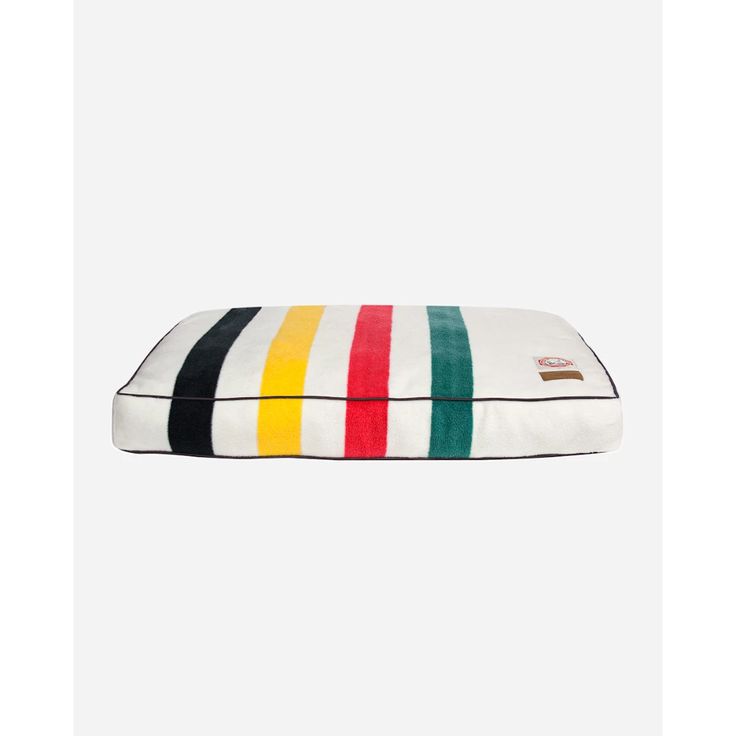 the rainbow striped dog bed is made from cotton