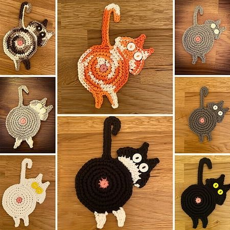 there are many crocheted cats on the table