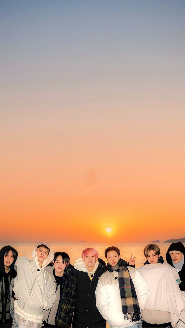 a group of people standing next to each other in front of a sunset with the words 7 min'n our youth