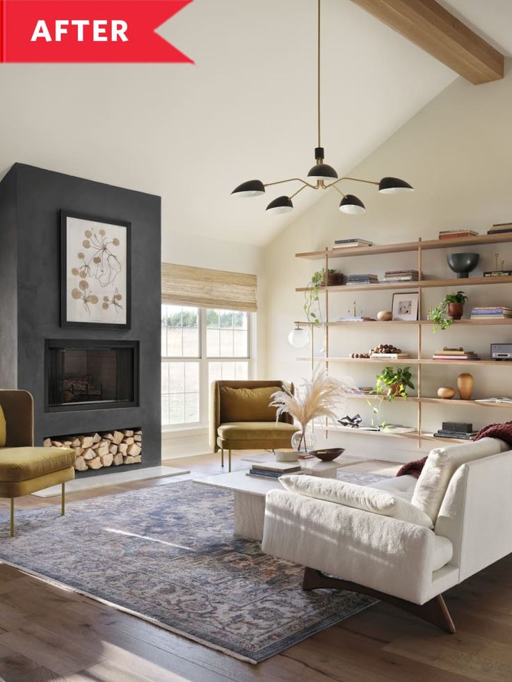 a living room filled with furniture and a fire place next to a wall mounted fireplace