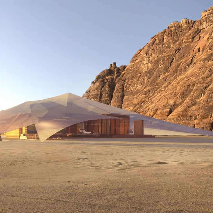 the desert is covered with sand and mountains are in the background, as well as a tent that sits on top of it