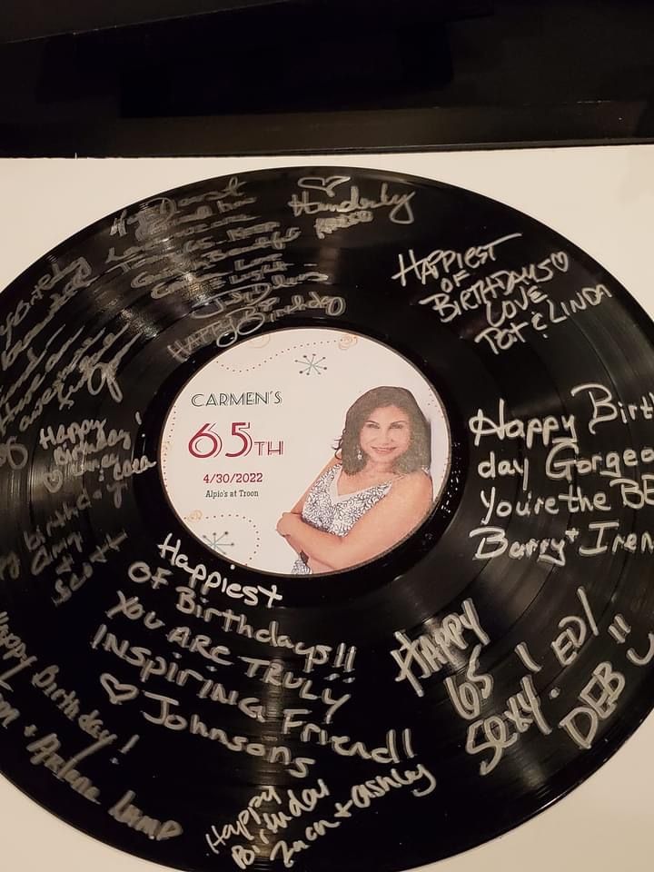 an autographed record with the names of all the stars and their families on it