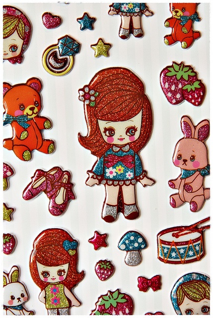 the girl is surrounded by many different patches and stickers on her body, including teddy bears