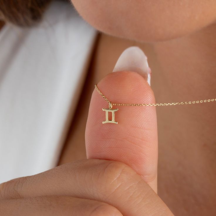 This minimalist Gemini symbol necklace can also be a thoughtful gift for your loved ones born under the sign of Gemini. Its simple design allows it to be worn on a daily basis. Yellow or rose gold options are available. In addition, it's shipped by express shipping like all our products. NECKLACE DETAILS * Material:14 carat solid gold * Weight: 0.90 grams (with 16 inch chain) * Dimensions: 5mm x 5mm * Style: Minimalist * Express shipping worldwide * 100% Handmade * Gift wrapping * Yellow and ros Gemini Necklace, Gemini Symbol, 20 Inch Necklace, 16 Inch Necklace, Symbol Necklace, Zodiac Necklace, Gemini Zodiac, Handmade Gift Wrap, Zodiac Necklaces